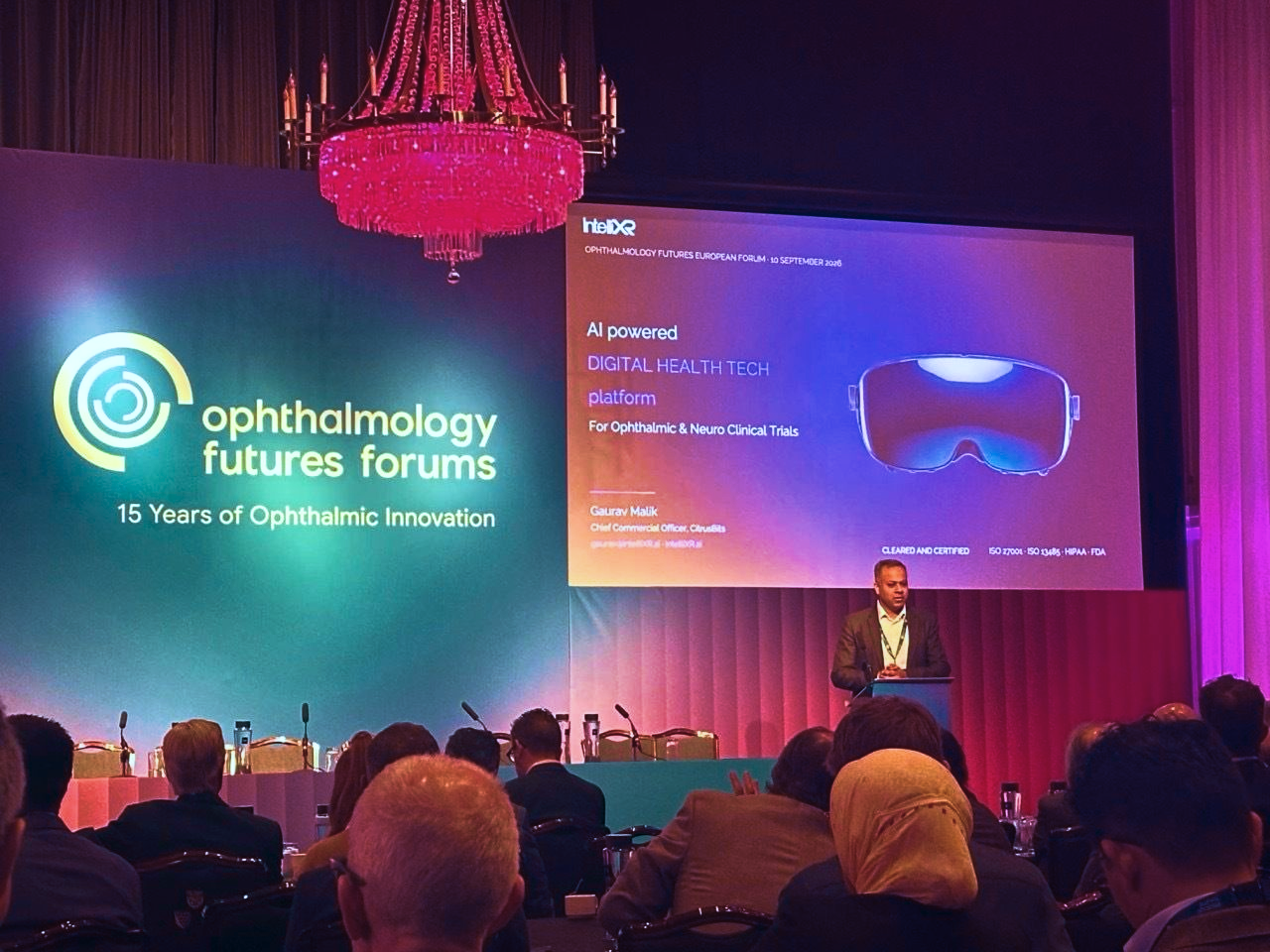 Gaurav Malik presenting IntelliXR on stage at the Ophthalmology Futures European Forum in Glaziers Hall, London
